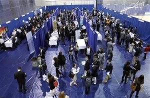 American University students walk among recruiting booths during a career job fair at American University in Washington