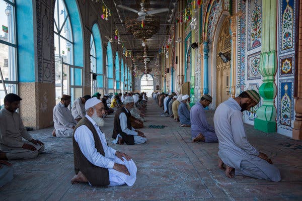 Afternoon prayer in Rawalpindi, Pakistan, on Thursday. Doctors have urged the government to order mosques to limit attendance to five worshipers at a time.